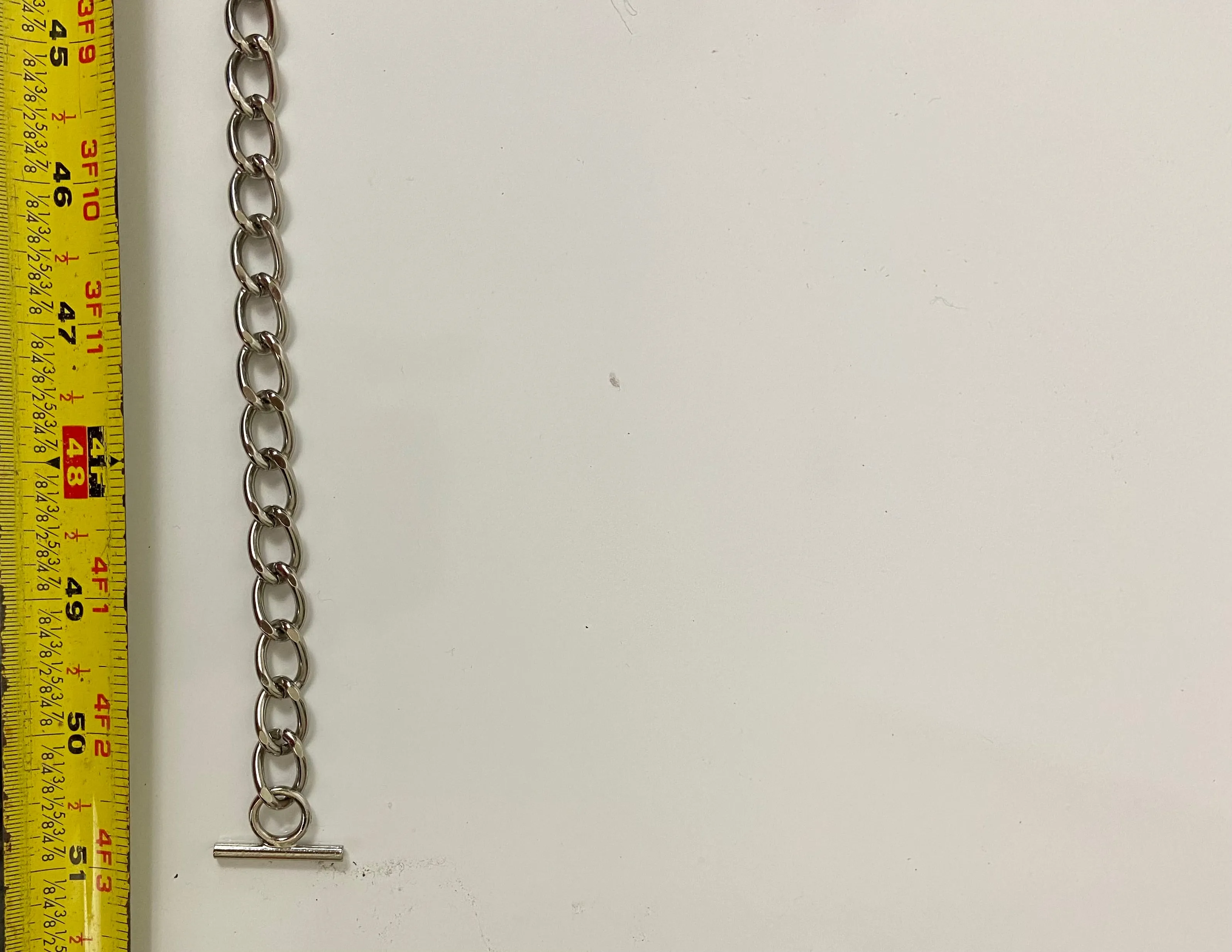 Reworked denim and chain belt